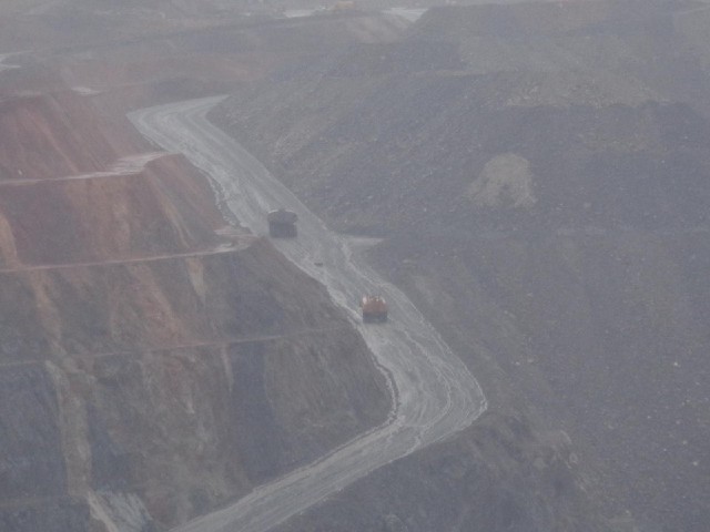 Two mining vehicles in the Superpit. It's hard to tell how big they are but I bet they're much bigge...