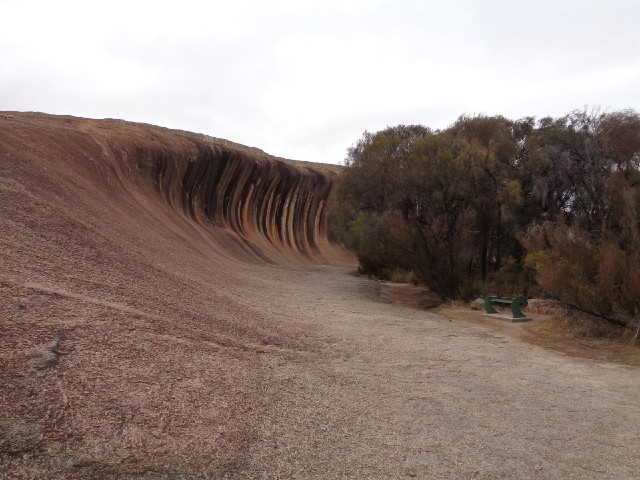 This is Wave Rock. Information boards explain that in the past, the surface of the soil was at the l...