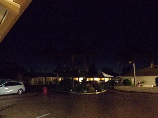 The motel at dusk. The pink things are two of the children who are running all over the place. They ...