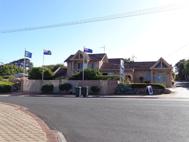 My motel, with flags flying proudly in the South wind. The one with a black swan on it is the flag o...