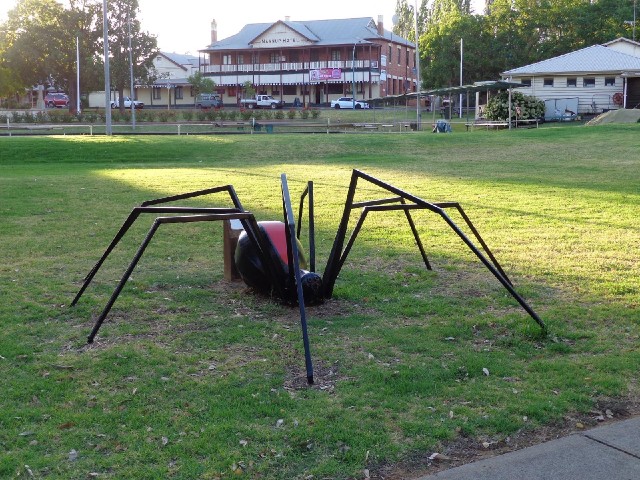 A big spider. The plaque behind it is blank.