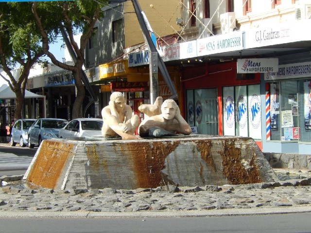 Statues watching the traffic.