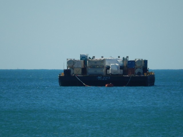 There are a few barges like this moored offshore here.