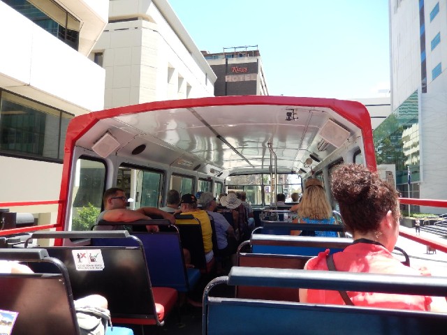 I've now got on a sightseeing bus. My hotel is ahead, the Central Law Court on the left and the Dist...