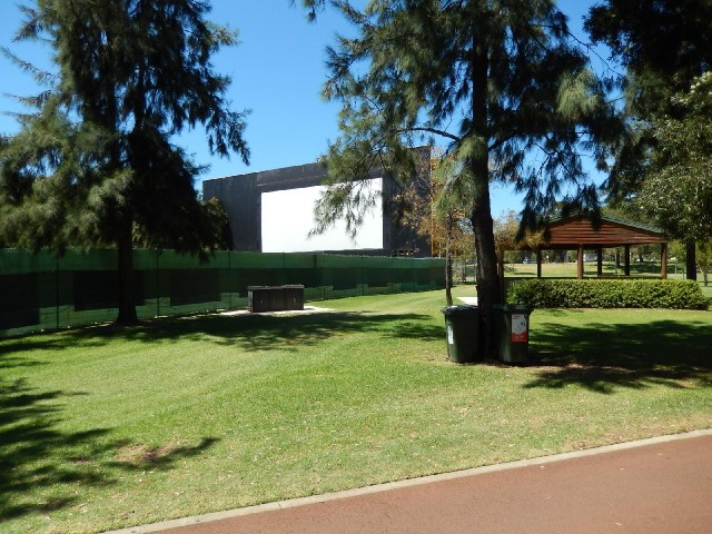 An outdoor cinema screen in the park.
