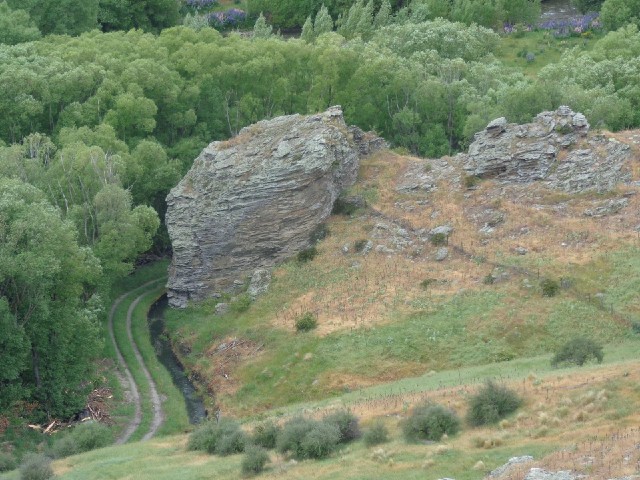 I think that's a little stream winding around that rock.