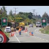 I don't think I've seen any temporary traffic lights in New Zealand. If a lane is closed, there are ...