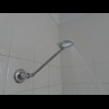 The shower head here is high enough but tiny. It works perfectly well though...