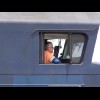 The driver of a passing coal train.