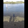 The water here is so clear that I can see my shadow on the bottom.