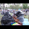 A brief light rain shower had made people suddenly try to find things to shelter under, such as bin ...