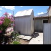 I've had lunch in the cafe here. The cafe's toilet is in this shed in its back garden, accessed from...