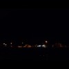 Glenrowan by night, with light glinting off the railway tracks at the bottom. As I'm in a small, dar...