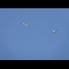 A plane towing a glider.