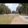 The pink gravel is a pedestrian and cycle path to let people from the town get to the motorway servi...