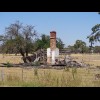 I've seen a few chimneys like this during my travels. The chimney must be the only brick part of a w...