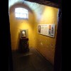 Each cell along this side of the cround floor gives the story of somebody who was executed here, alo...