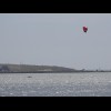 Somebody doing something with a kite on Lake Albert.