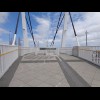 A bridge across the Kwinana Freeway. The artwork on the railings and in the ground references the Sw...