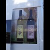 This is an advert for wine on the side of a van. It shows that magpies have the same reputation for ...