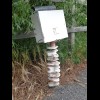 This mailbox is made from an engine camshaft.
