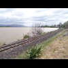 Lake Waihola with the railway line, which still carries freight but not passengers.