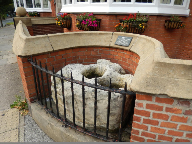 According to a sign this is the Burton Stone. It is thought to be the base of an old cross and when ...