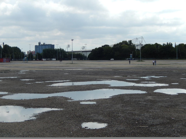 The KC Stadium, also known as the Circle, seen across its vast car park.