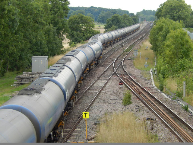 A train snaking its way onto a side track.