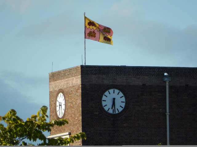 The flag on Glendour University, which is next to the ground and sponsors it.