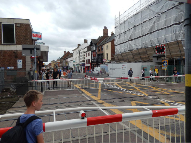 The railway line comes right across the main shopping street. A footbridge is under construction.