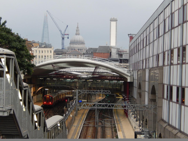 Farringdon station, with St. Paul's Cathedral and the Shard in the background.
