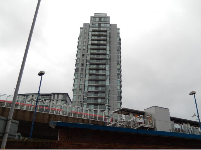 A Docklands Light Railway station and a tower block in Deptford.
