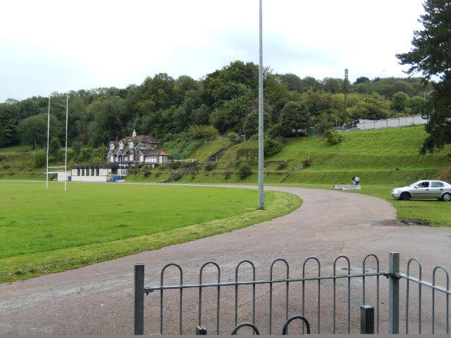 There are two rugby pitches on the elliptical grass area on the left. The ornate building is their p...