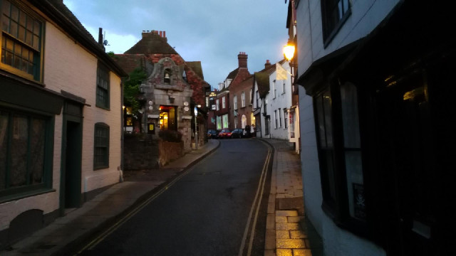 The stone building on the left is the Old Bell Inn.