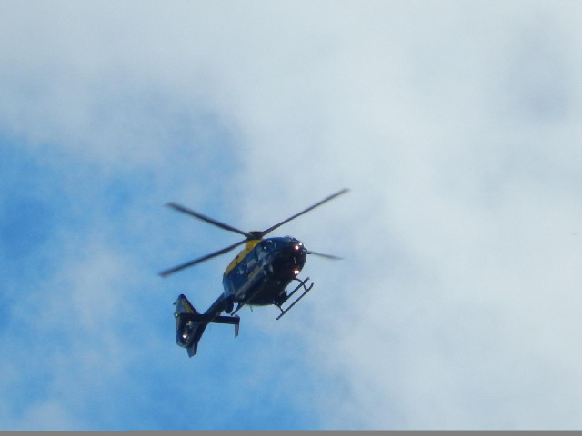 A police helicopter inspecting the traffic jam that I've got stuck in.