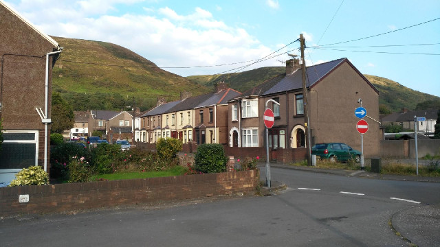 Port Talbot, at the foot of the hills.