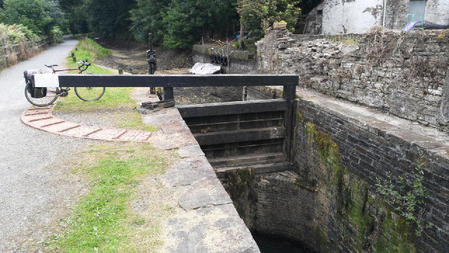 The section of canal beyond the lock gate has no water in it. What surprised me was the shape of the...