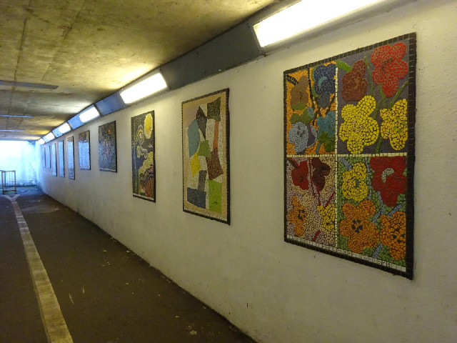 Each of these mosaics in the underpass was made by a different local junior school and is in the sty...