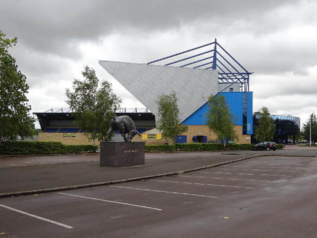 The Kassam Stadium with a sculpture of a bull.