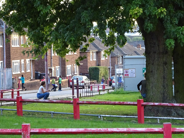 Children playing football in the street. The two girls in the foreground were taking photographs of ...