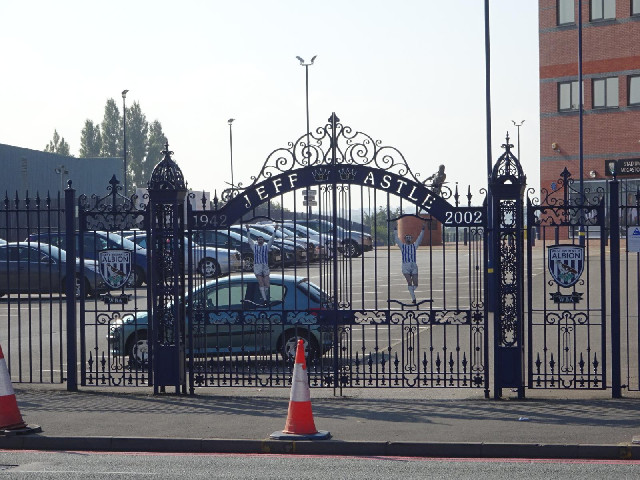 Gates commemorating the player Jeff Astle. I wonder whether they came from the place immediately acr...
