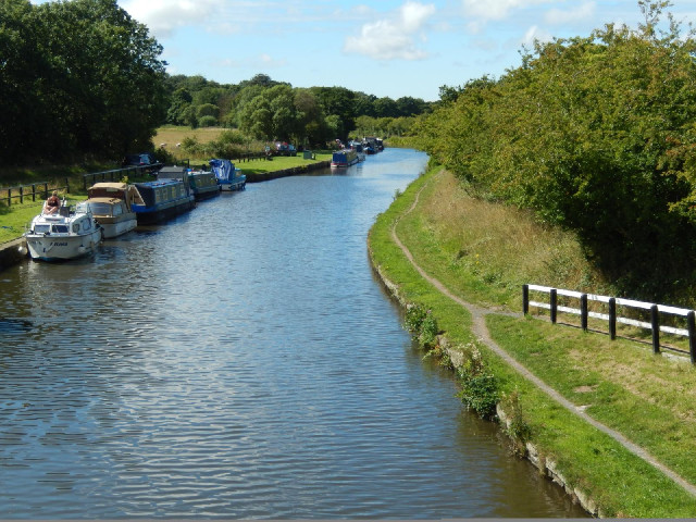 Back onto a canal again. The towpath would go through a variety of styles along the way but was neve...