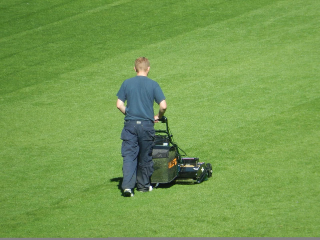 Mowing the pitch.