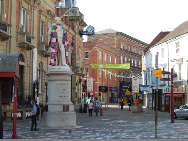 The statue, wearing a scarfe covered in stamps, is Sir Rowland Hill, who was born in Kidderminster a...