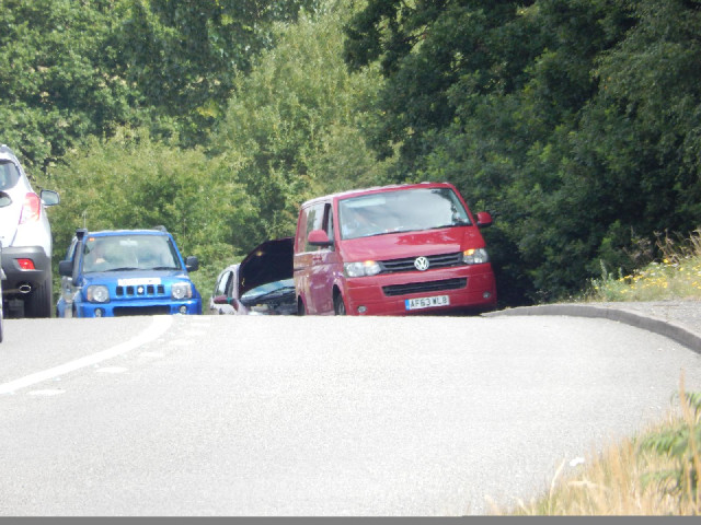 I saw this van at the bottom of this hill towing the car. When I passed them just now, it looked lik...