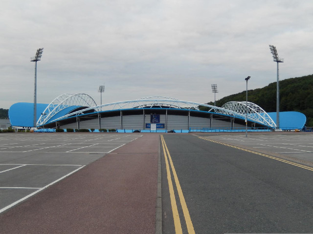 The John Smith's Stadium, home of Huddersfield Town. First game 1994. Capacity 24500. I don't have t...