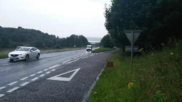 A large hill on a busy road in the rain. There would be no more major hills after this today but the...