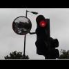 For some reason, these traffic lights have a mirror so you can see what's in the queue behind you.