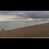The beach at Hythe. Dungeness nuclear power station is on the horizon on the left. All the land on t...